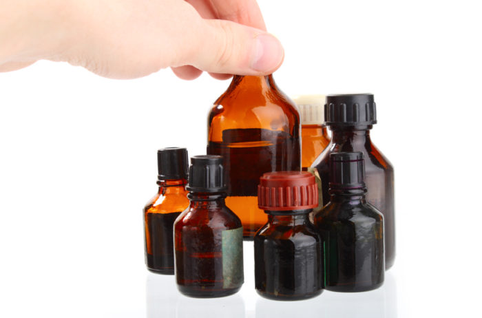 Hand holding vial .Medicament medicine